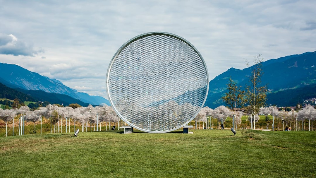 Swarovski Crystal Worlds outdoor art installation with mountain backdrop.