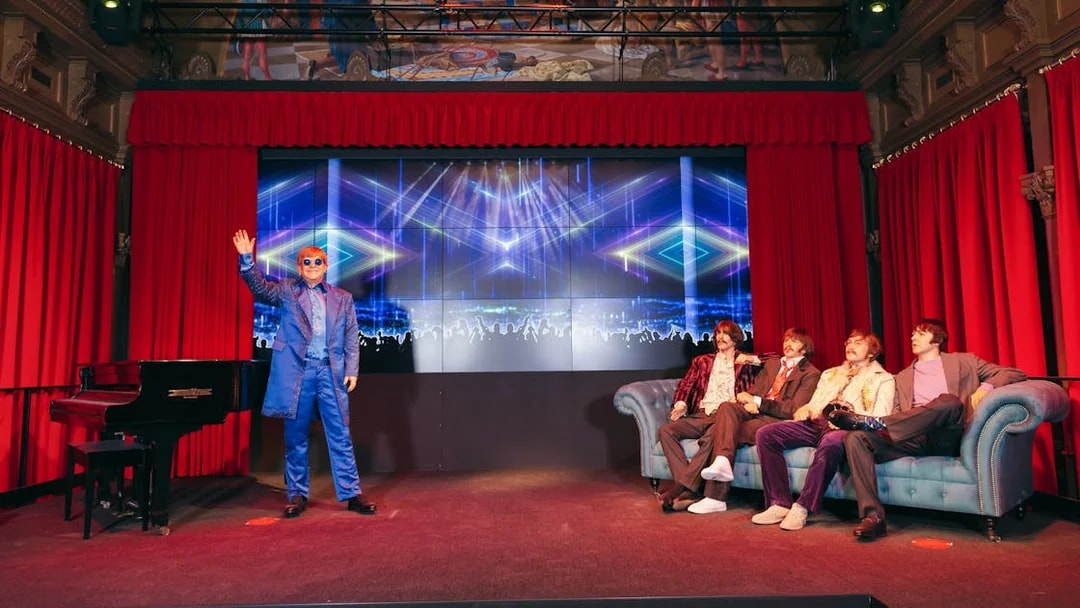 Wax figures of musicians on stage at Wax Museum Barcelona.