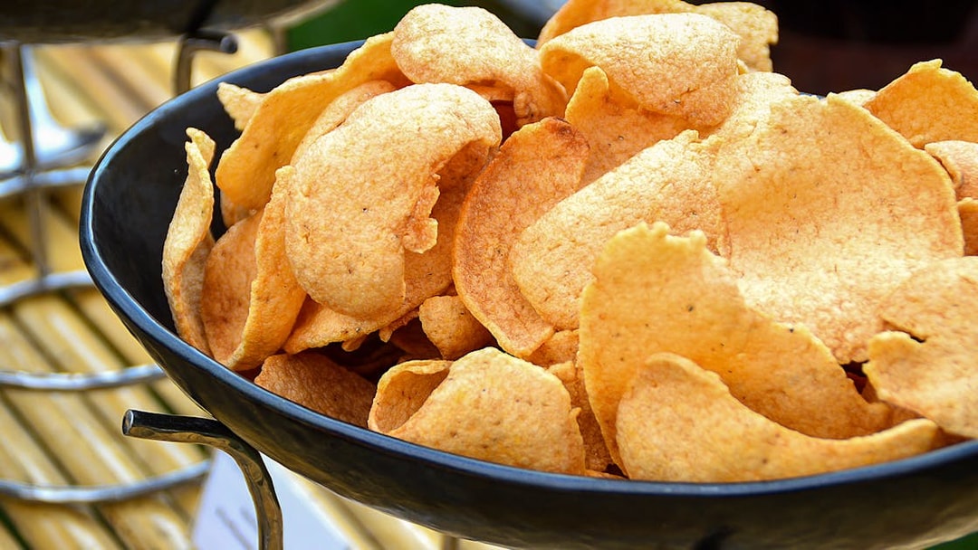 Crispy prawn crackers in a bowl at SkyFeast, Sydney Tower dining experience.