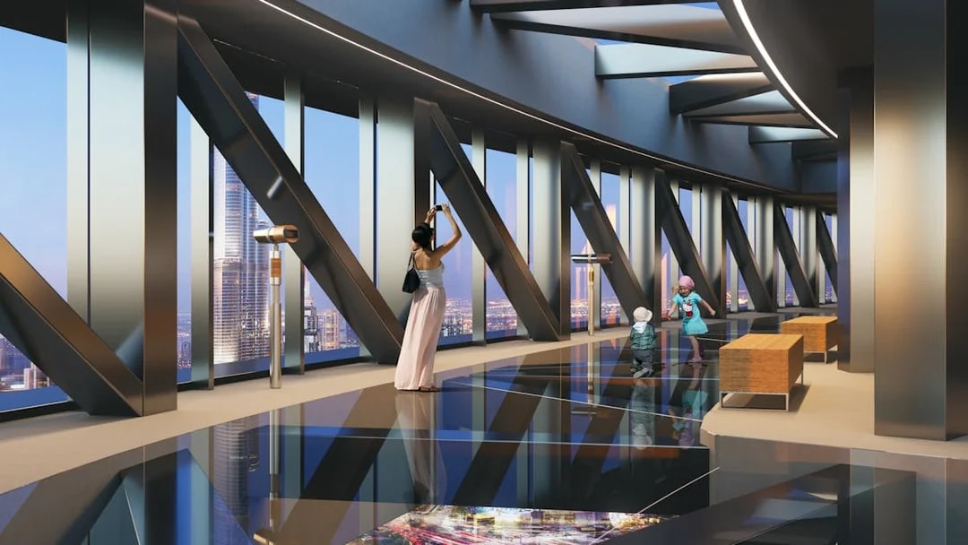 Family enjoying views at Sky Views Observatory, Dubai.