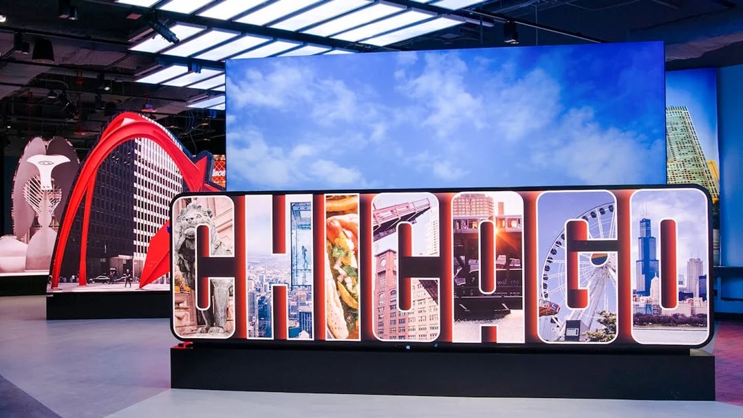 Skydeck Chicago exhibit featuring iconic city landmarks and Willis Tower.