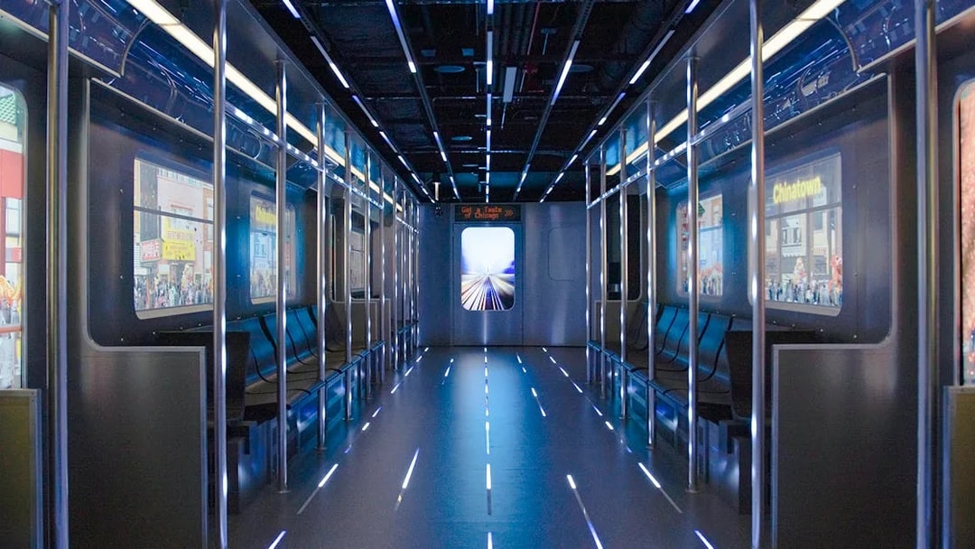Replica of the L train interior at Skydeck Chicago with cityscape views.