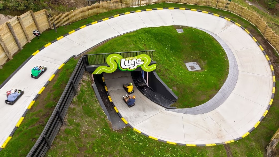 Aerial view of luge track with riders at Skyline Luge, Kuala Lumpur.