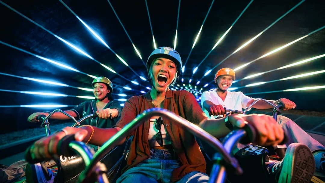 Riders enjoying the Skyline Luge track in Sentosa Island, Singapore.