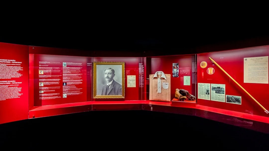 Benfica Stadium museum exhibit featuring Cosme Damião memorabilia and historical artifacts.