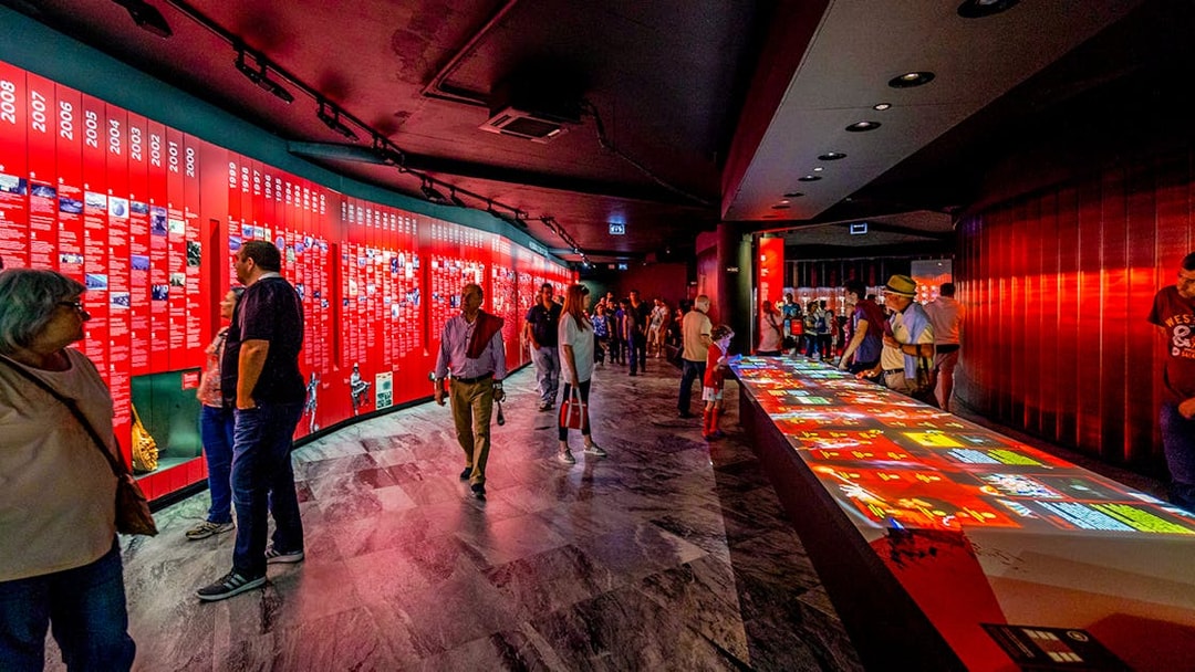 Visitors exploring exhibits at Benfica Stadium museum experience in Lisbon.