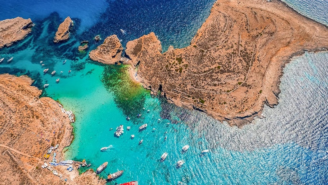 Aerial view of boats near Comino's Blue Lagoon, Malta, on a Turkish Gulet cruise from Sliema.
