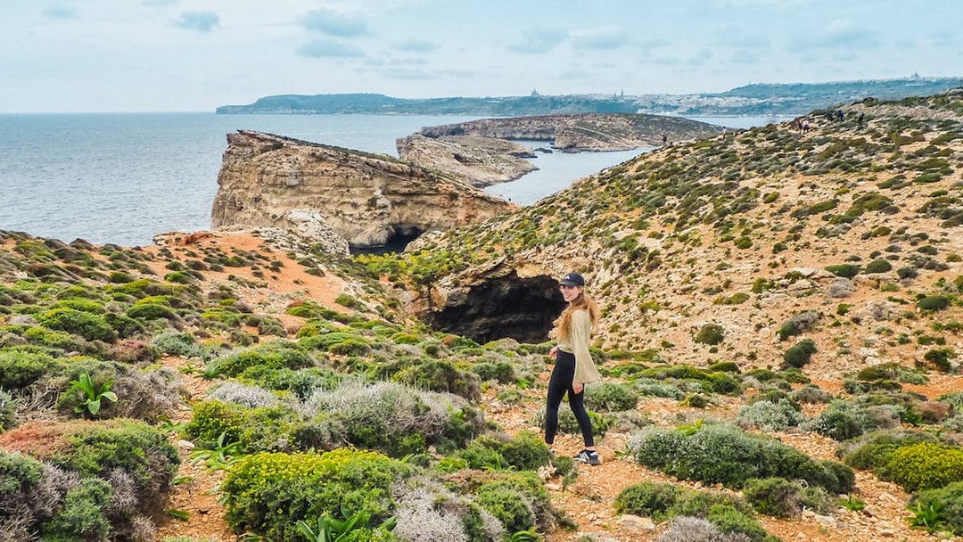 Cruise view of Gozo and Comino cliffs from Sliema on a Turkish Gulet tour.