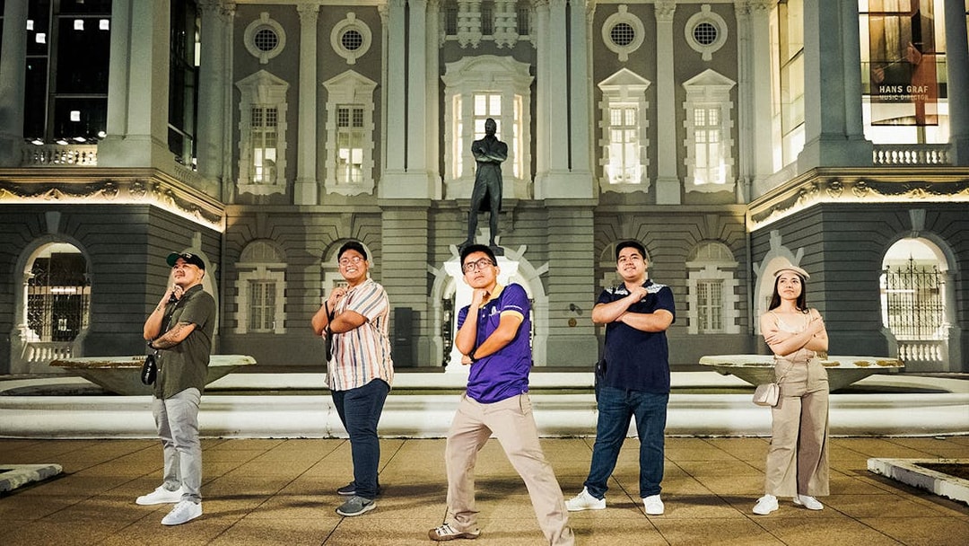Group posing in front of the Asian Civilisations Museum during Singapore Street Food & Night Tour.