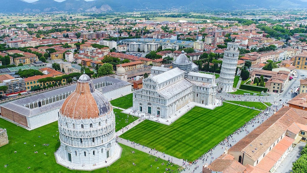 Aerial view of Piazza dei Miracoli in Pisa with the Leaning Tower, Cathedral, and Baptistery.