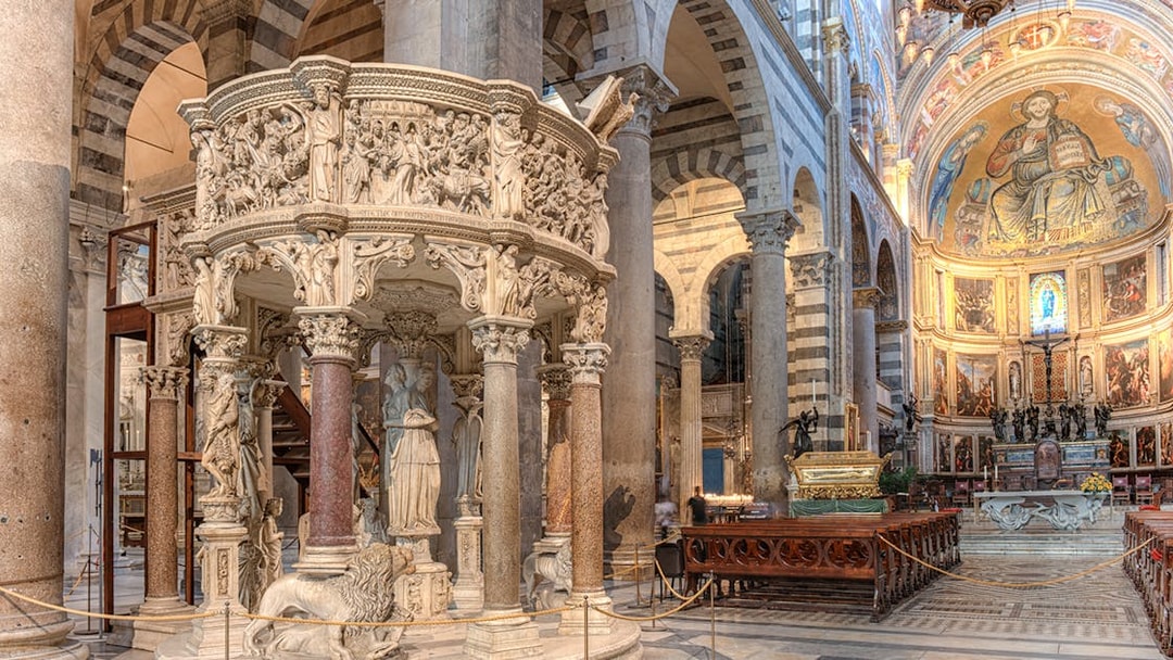Pulpit with detailed sculptures inside Pisa Cathedral, Italy.