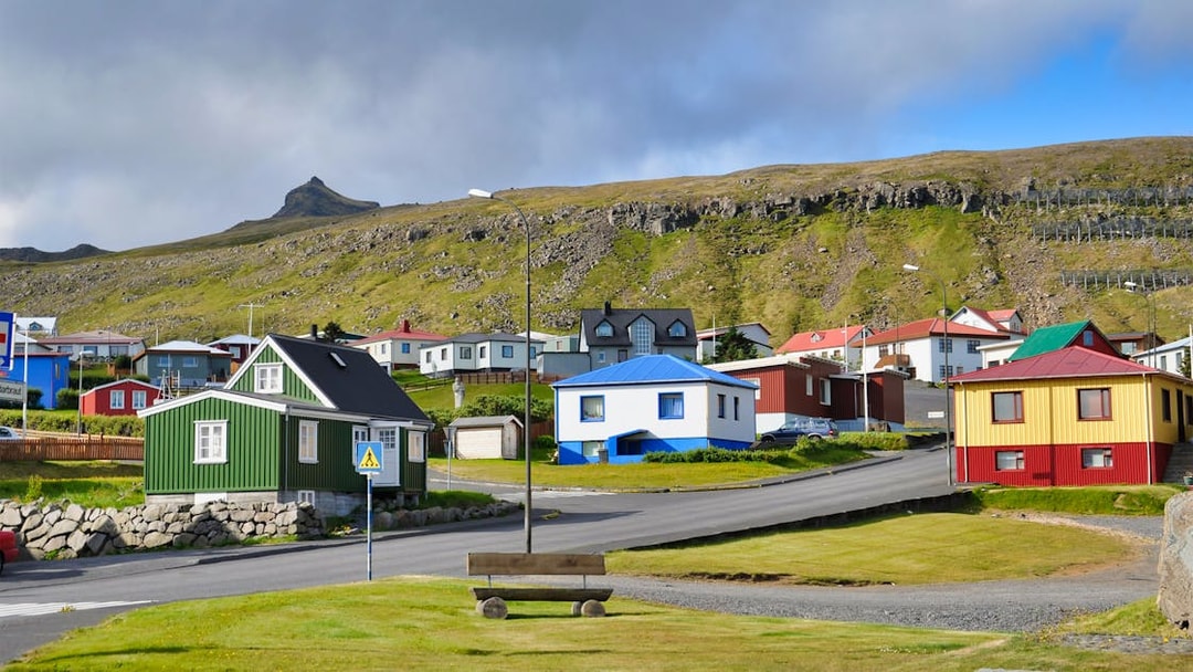 Colorful houses in a village on the Snaefellsnes Peninsula, Iceland, with a mountain backdrop.