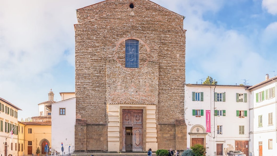 Church of Santa Maria del Carmine facade in Florence, Italy, with surrounding buildings.