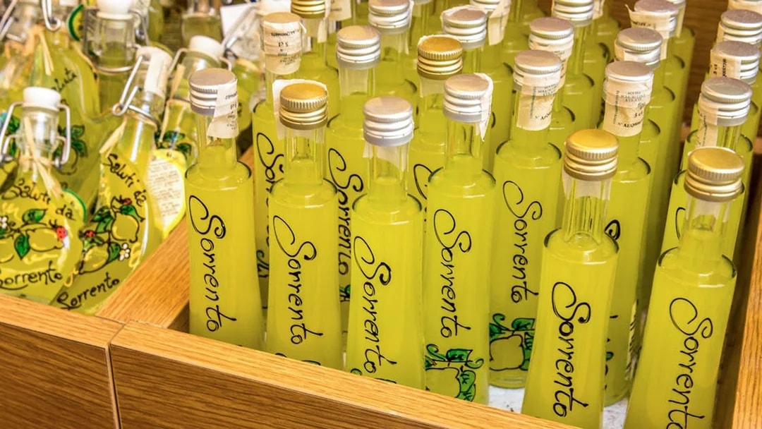 Bottles of limoncello labeled "Sorrento" at a local shop.