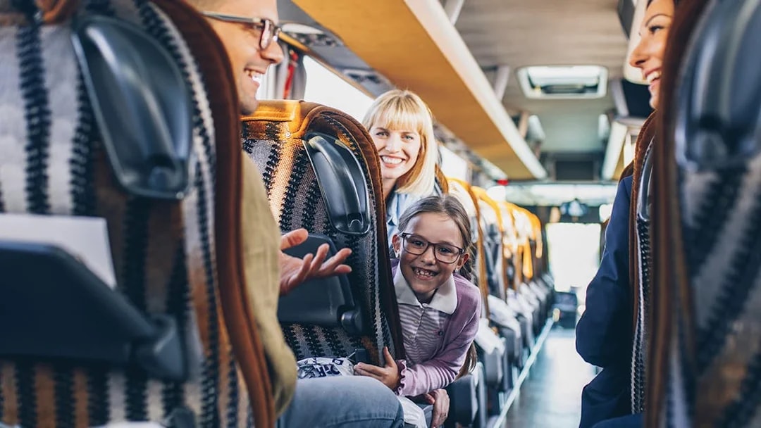 Passengers enjoying a ride on a Terravision bus from Fiumicino Airport to Rome City Center.