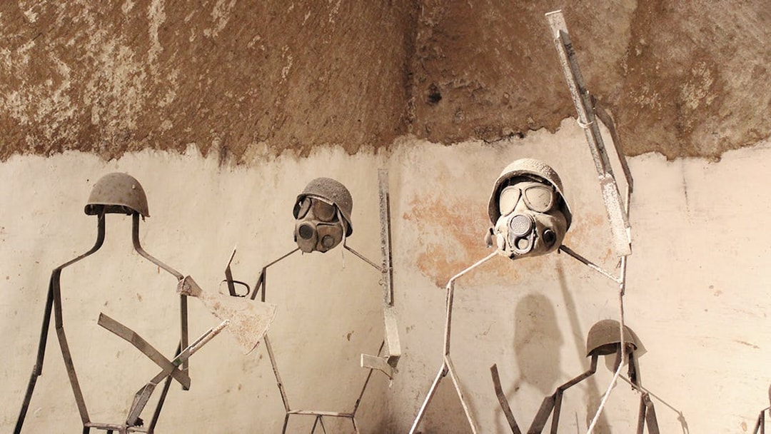 Naples Underground display of metal figures with military helmets and gas masks.
