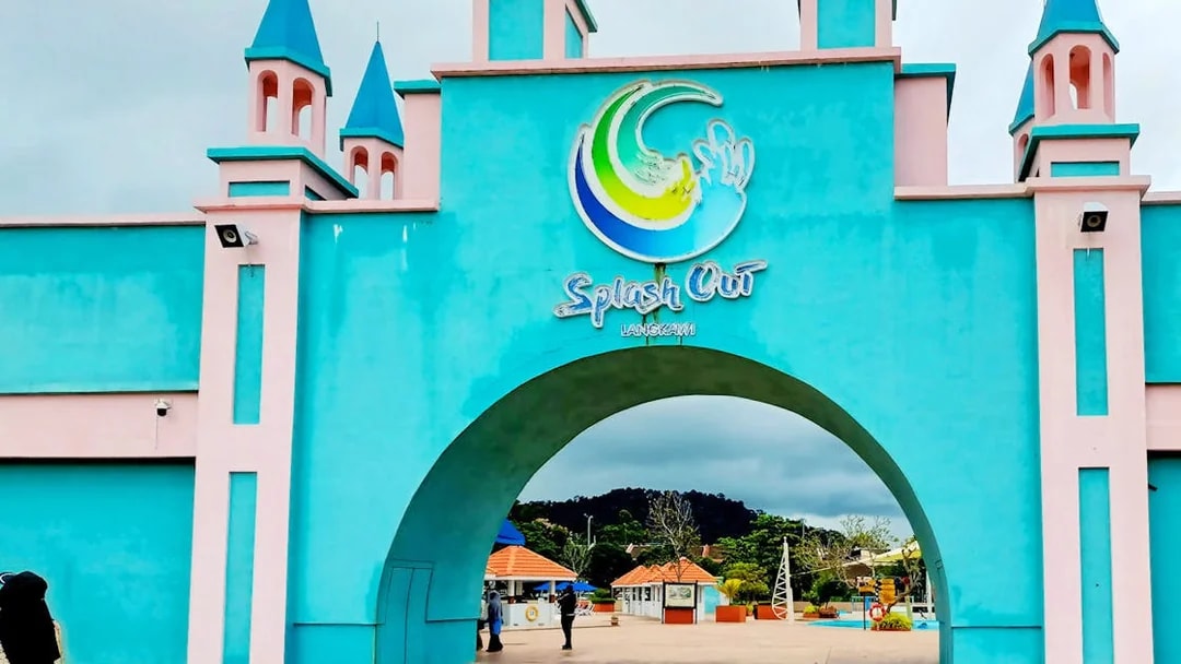 Entrance of Splash Out Langkawi Water Theme Park with colorful archway and towers.