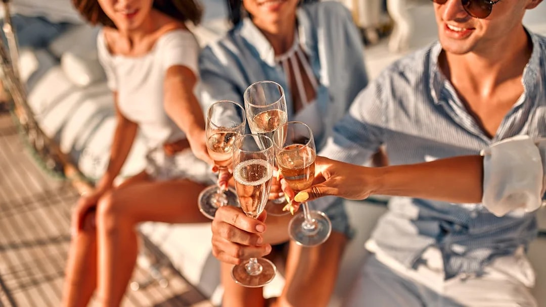 Guests toasting with champagne on a Split Riviera cruise.