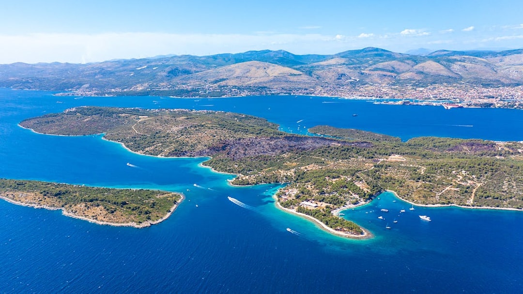 Aerial view of islands near Split, Croatia, featuring boats in the Blue Lagoon.