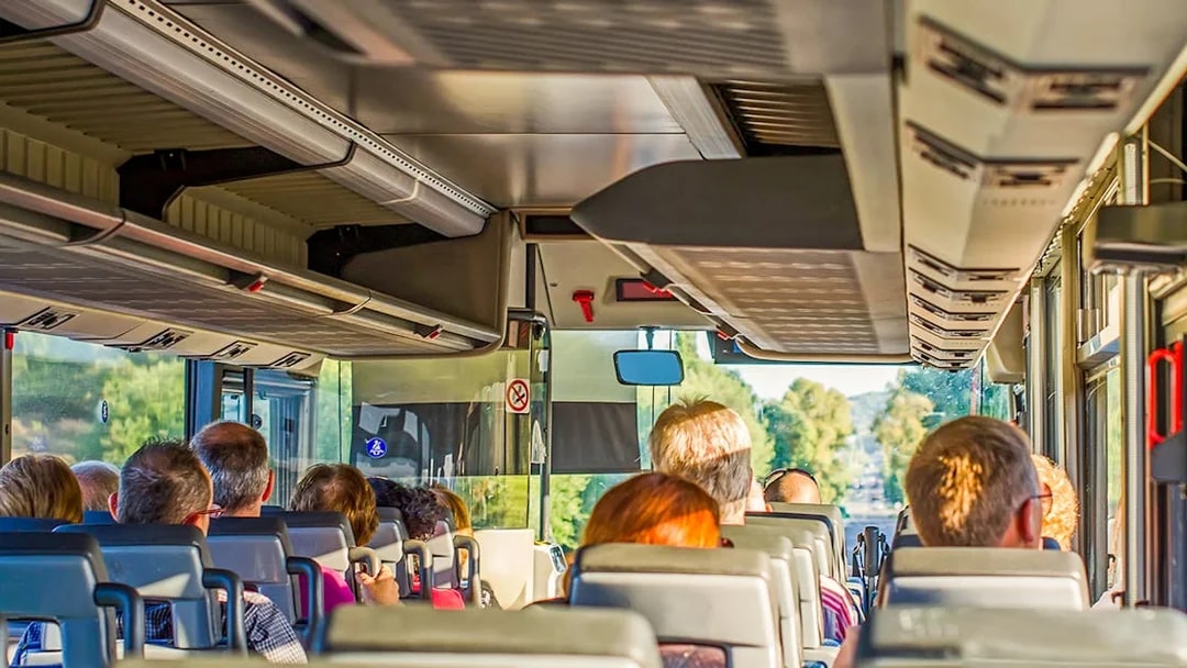 Tourists on a bus heading to Krka Waterfalls from Split, Croatia.