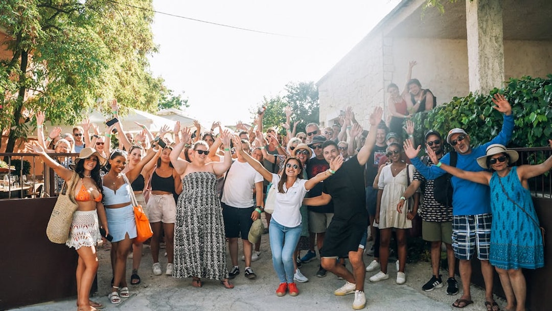 Group of tourists enjoying Krka Waterfalls tour and wine tasting near Split.