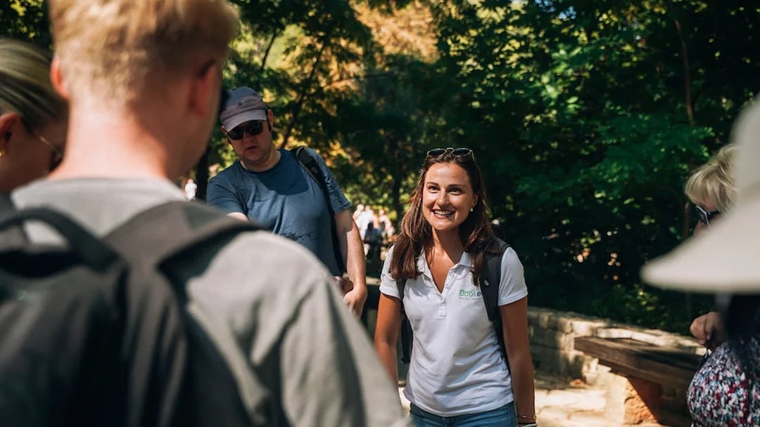 Tour guide leading a group at Krka Waterfalls, Split.