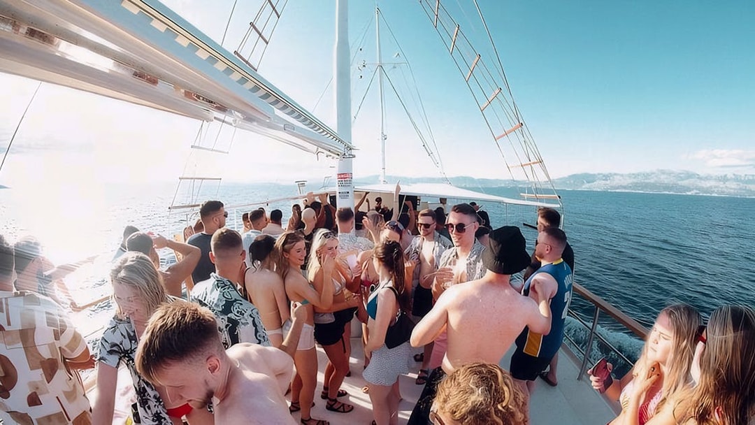 Guests enjoying Split Party Cruise on a boat with ocean views.