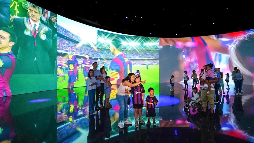 Visitors exploring interactive displays at the Spotify Camp Nou Barça Museum.