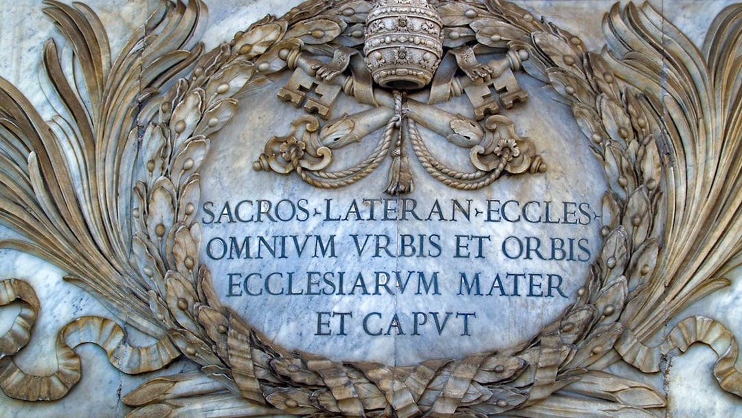 St. John Lateran inscription with papal symbols in Rome, Italy.