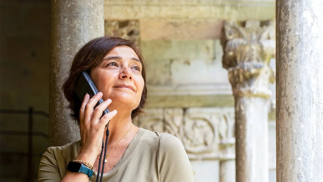 Tourist using audio guide at St. Mark's Basilica, Venice.