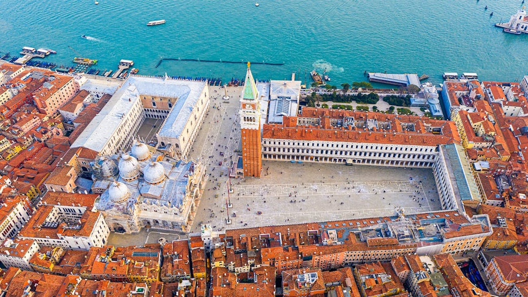 Aerial view of San Marco Square and Basilica of Saint Mark during a helicopter tour in Venice.