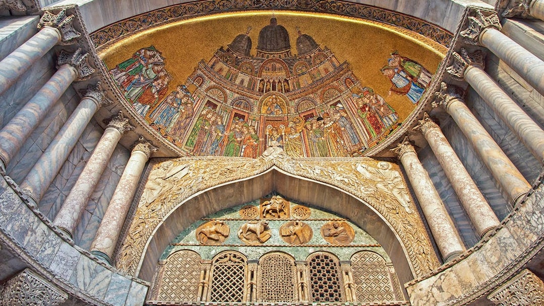 Mosaic and marble columns inside St. Mark's Basilica, Venice.