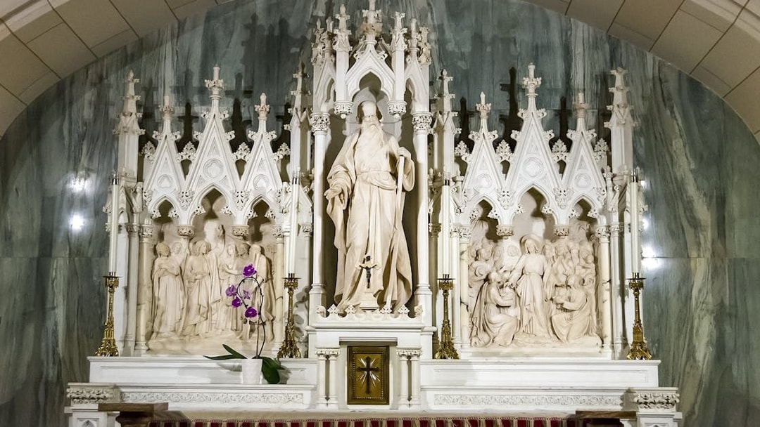 St. Patrick's Cathedral altar with intricate sculptures and floral decoration.