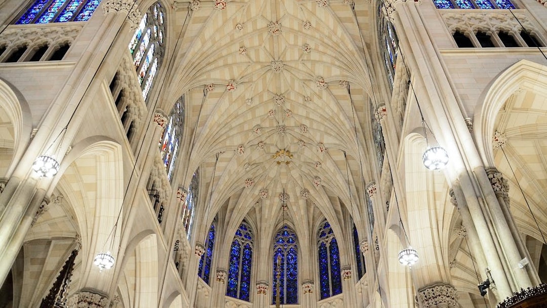 St. Patrick's Cathedral interior ceiling with stained glass windows, New York City.