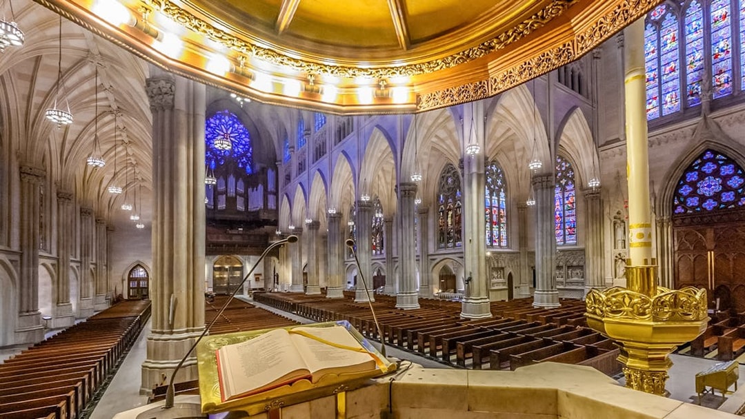 St. Patrick's Cathedral interior with stained glass windows and pulpit, New York City.