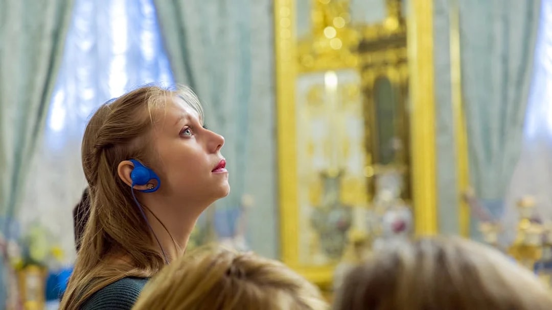 Visitor with audio guide exploring Moco Museum, Barcelona.