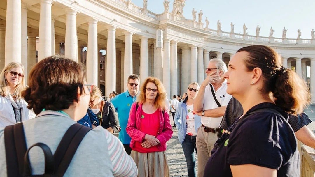 Tour group with guide at St. Peter’s Basilica, Vatican City.