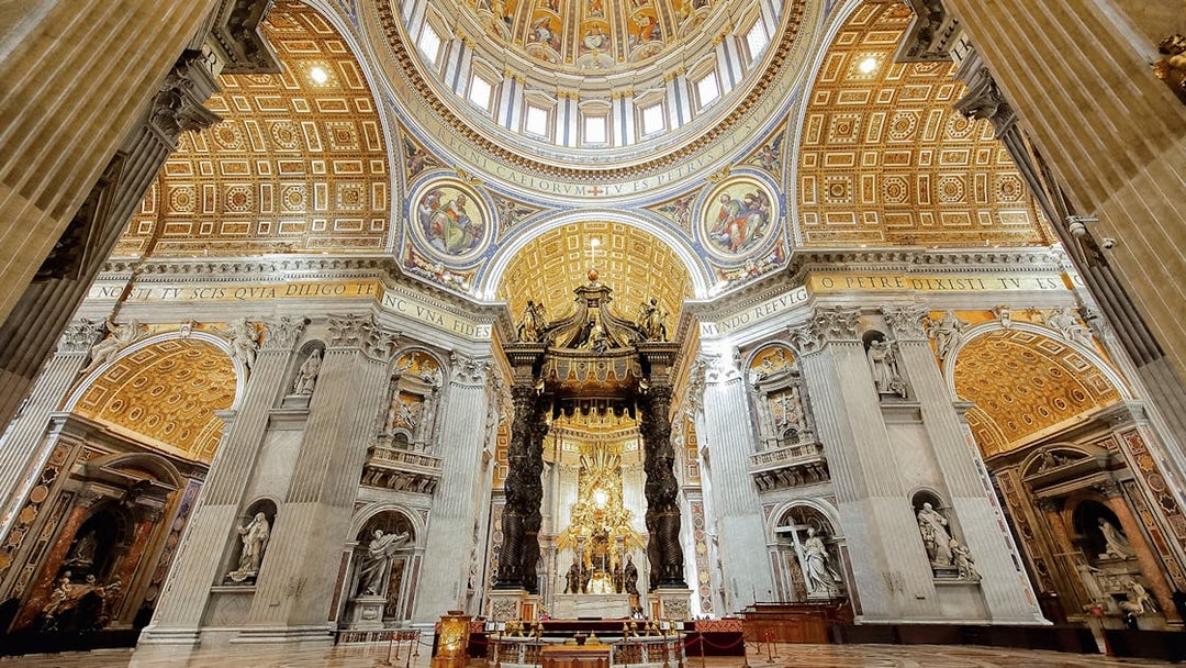 St. Peter’s Basilica interior with ornate dome and Bernini's Baldachin, Vatican City.