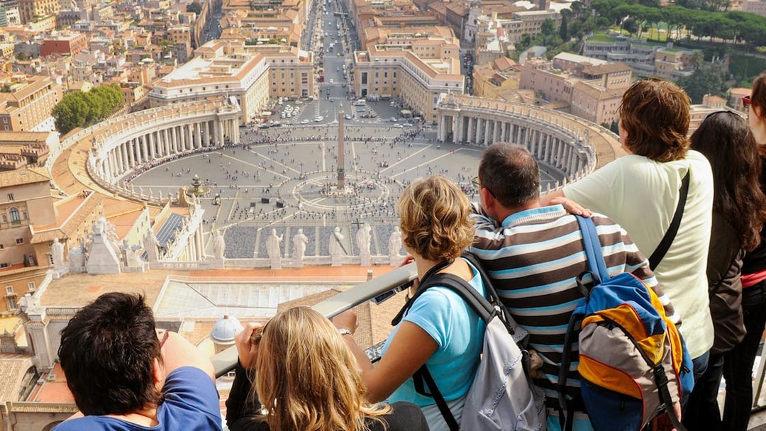 Tourists viewing St. Peter's Square from the dome of Saint Peter's Basilica, Vatican City.