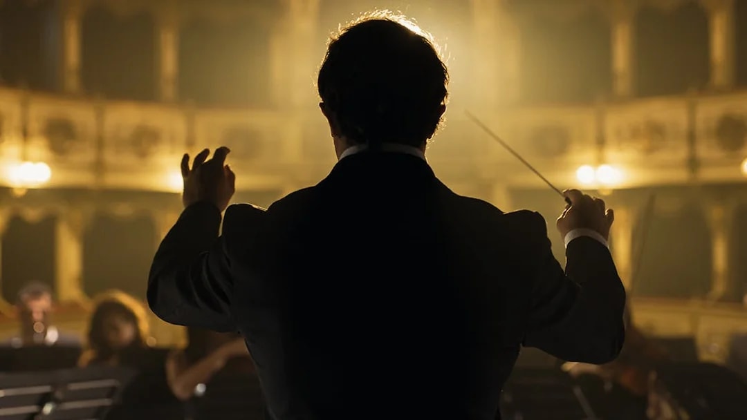 Conductor leading orchestra at Classic Ensemble Vienna Concert, St. Peter's Church.