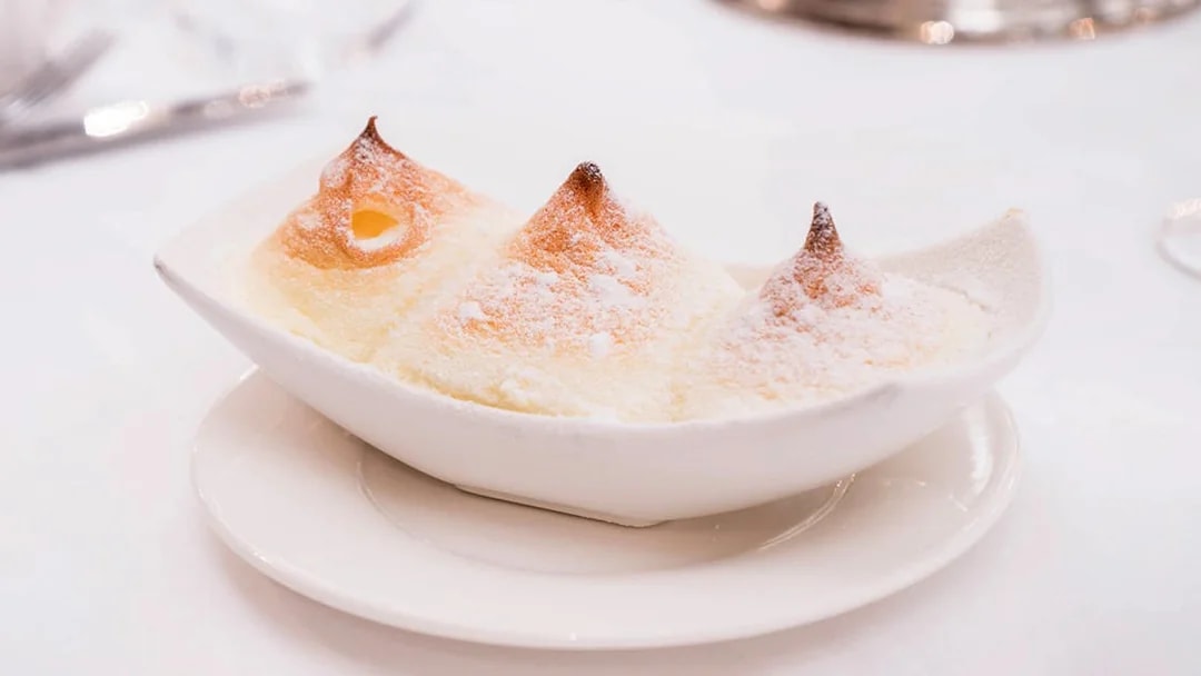 Salzburg dessert Salzburger Nockerl served in a white dish, part of a 3-course dinner.