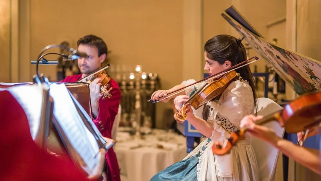 Musicians in period costumes performing at a Mozart concert in Salzburg.