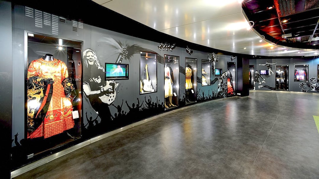 Museum exhibit with costumes and memorabilia at Stade de France, Paris.