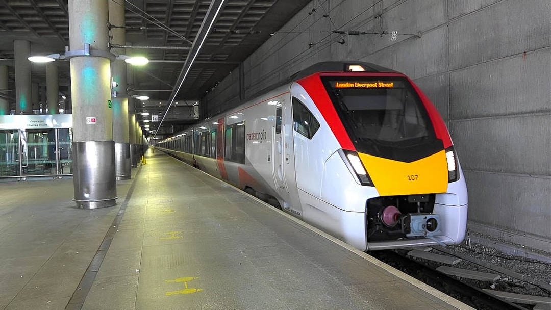Stansted Express train arriving at a London station platform.