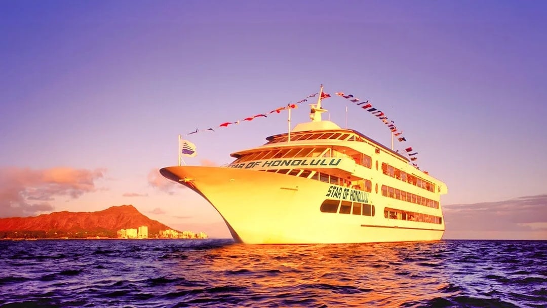 Cruise ship sailing near Diamond Head, Honolulu at sunset.