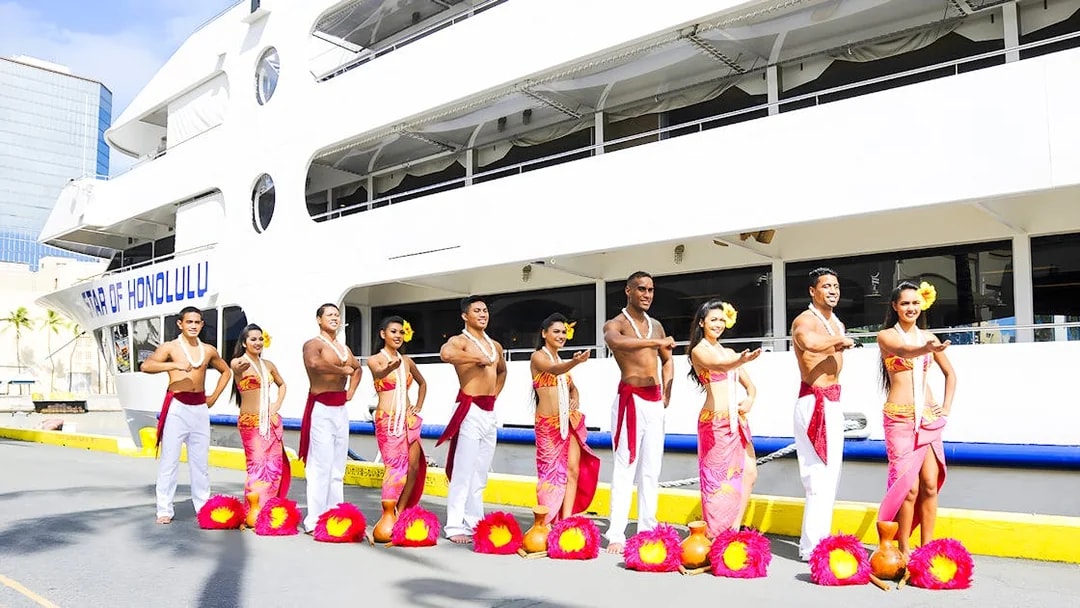 Performers in traditional attire in front of the Star of Honolulu, Three Star.
