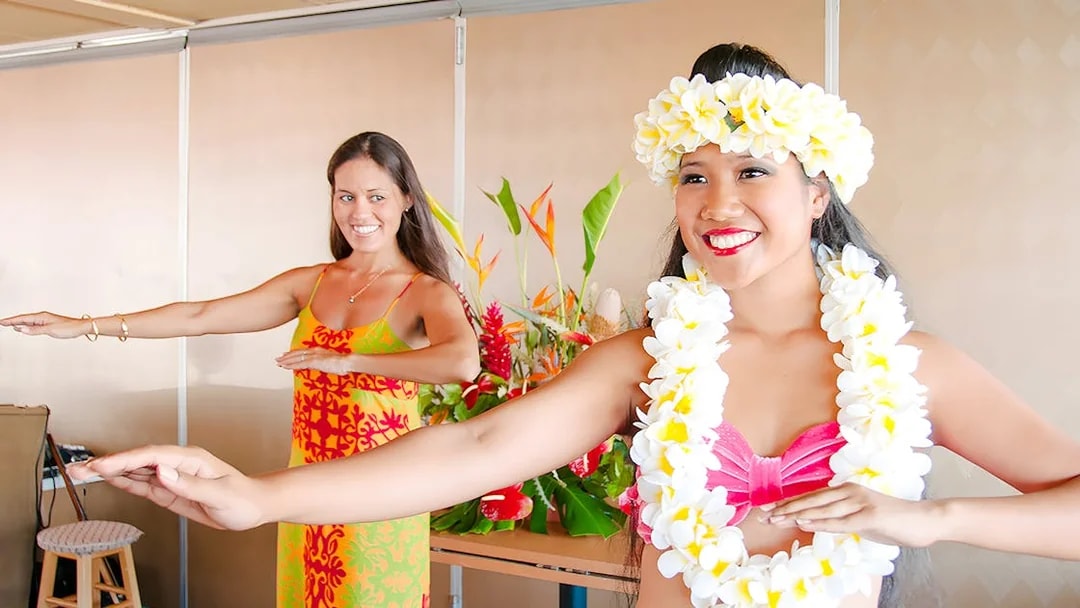 Two women perform hula dance on Star of Honolulu cruise.