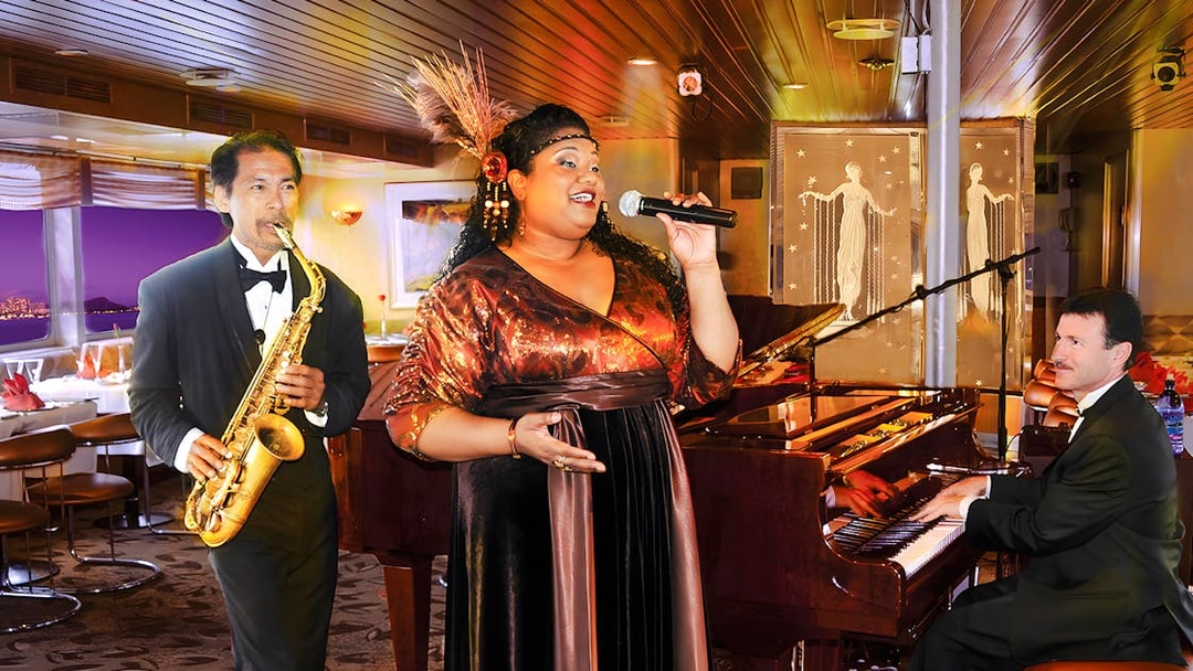 Performers at Nova Five Star 2 with singer, saxophonist, and pianist on stage.