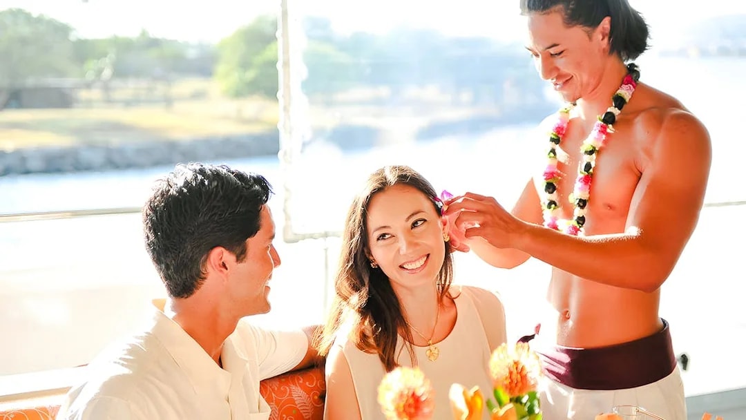 Guests enjoying a flower ceremony on the Star of Honolulu, Three Star cruise.