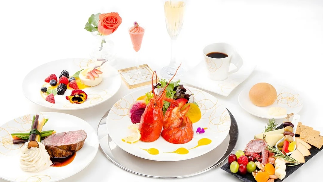 Seafood platter with lobster, assorted fruits, and gourmet dishes on Nova Five Star 2.